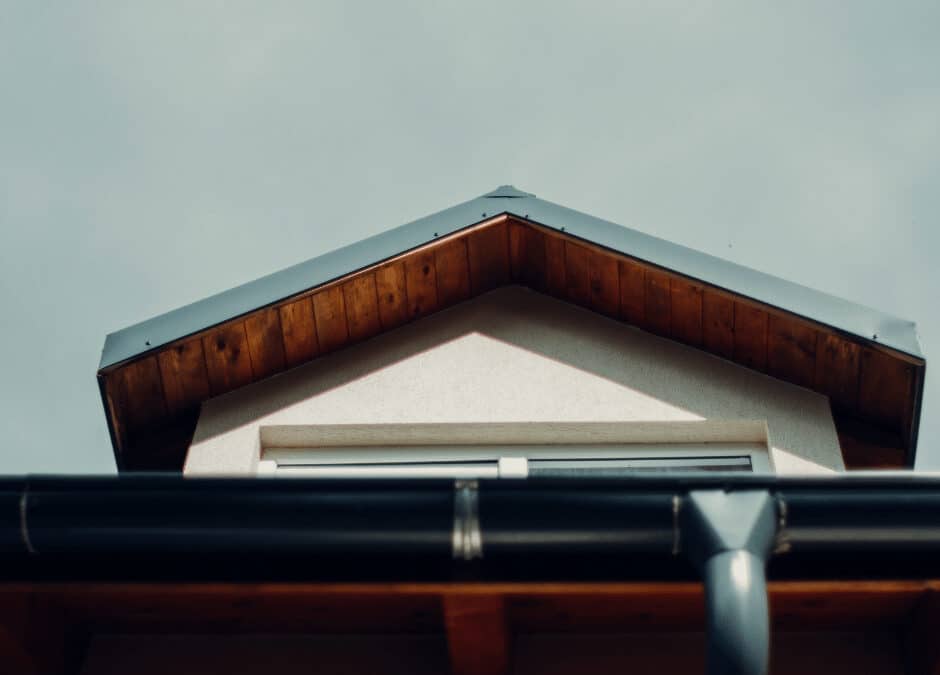 The gutter system attached to the roof of a house